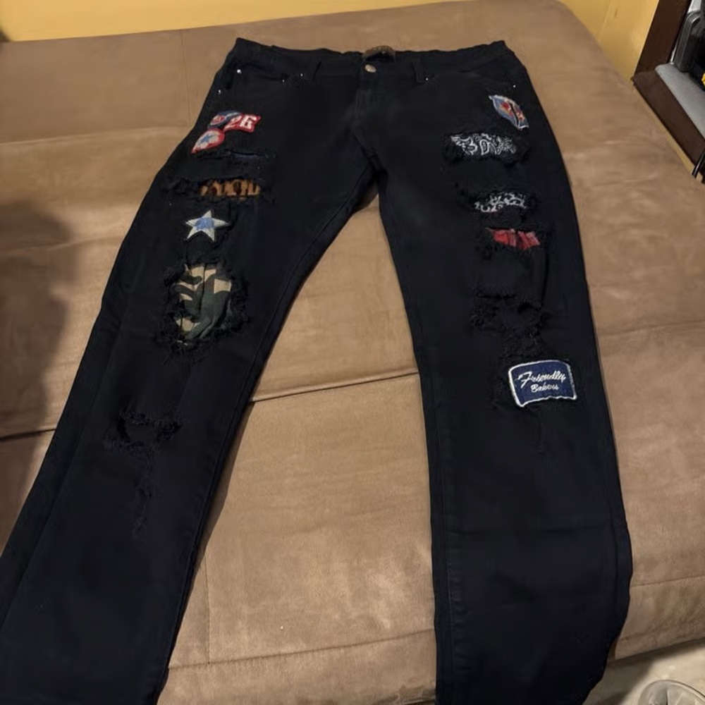 AMIRI Black Skinny Jeans with Mixed Patch Appliqués